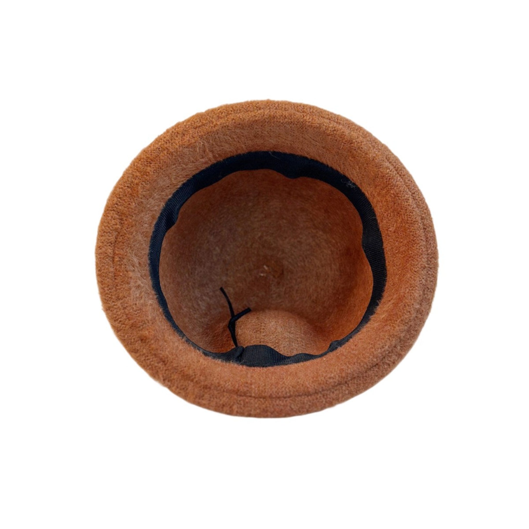 Close-up of tan wool bucket hat interior, showing soft lining and craftsmanship