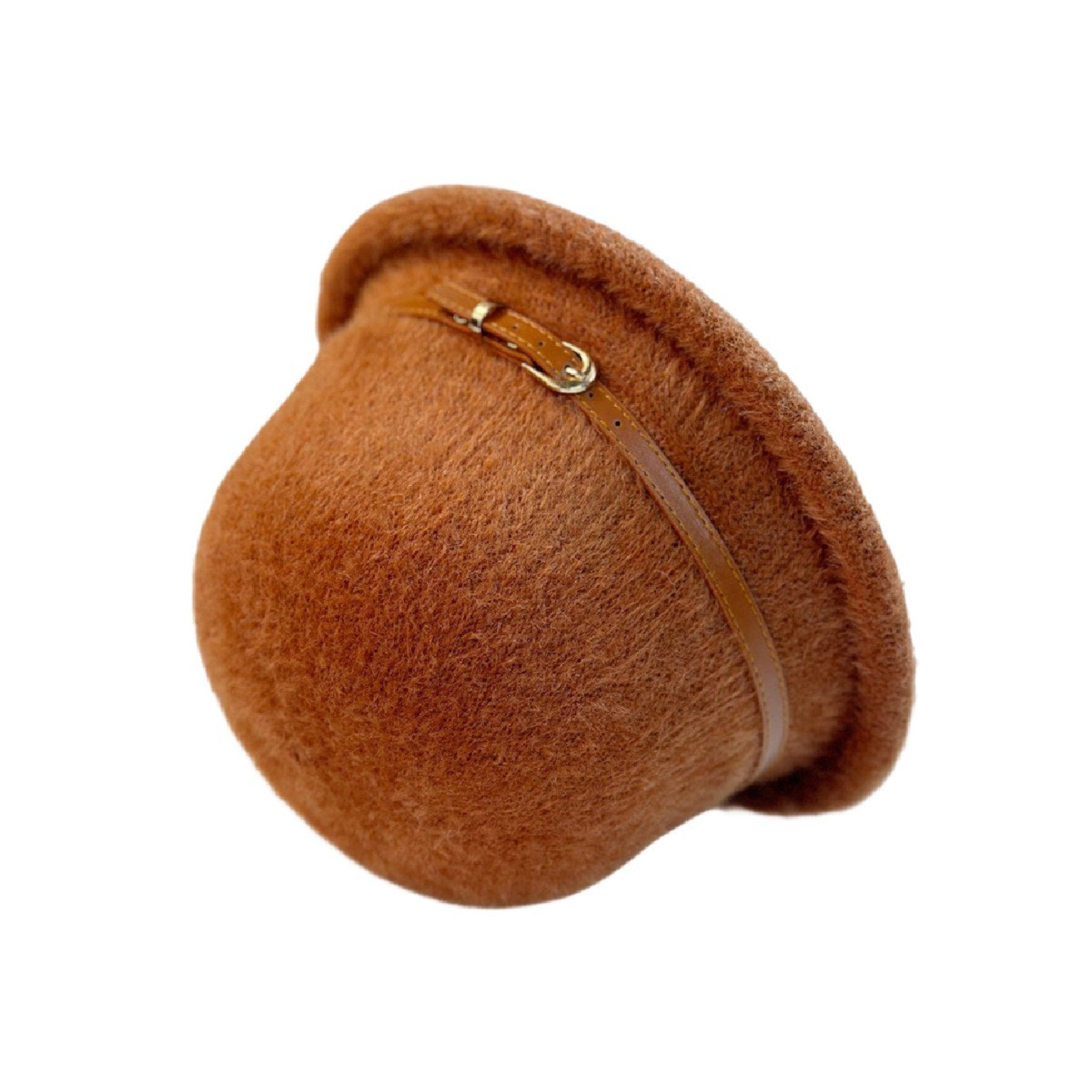 Side view of tan wool bucket hat showing leather button and structured crown