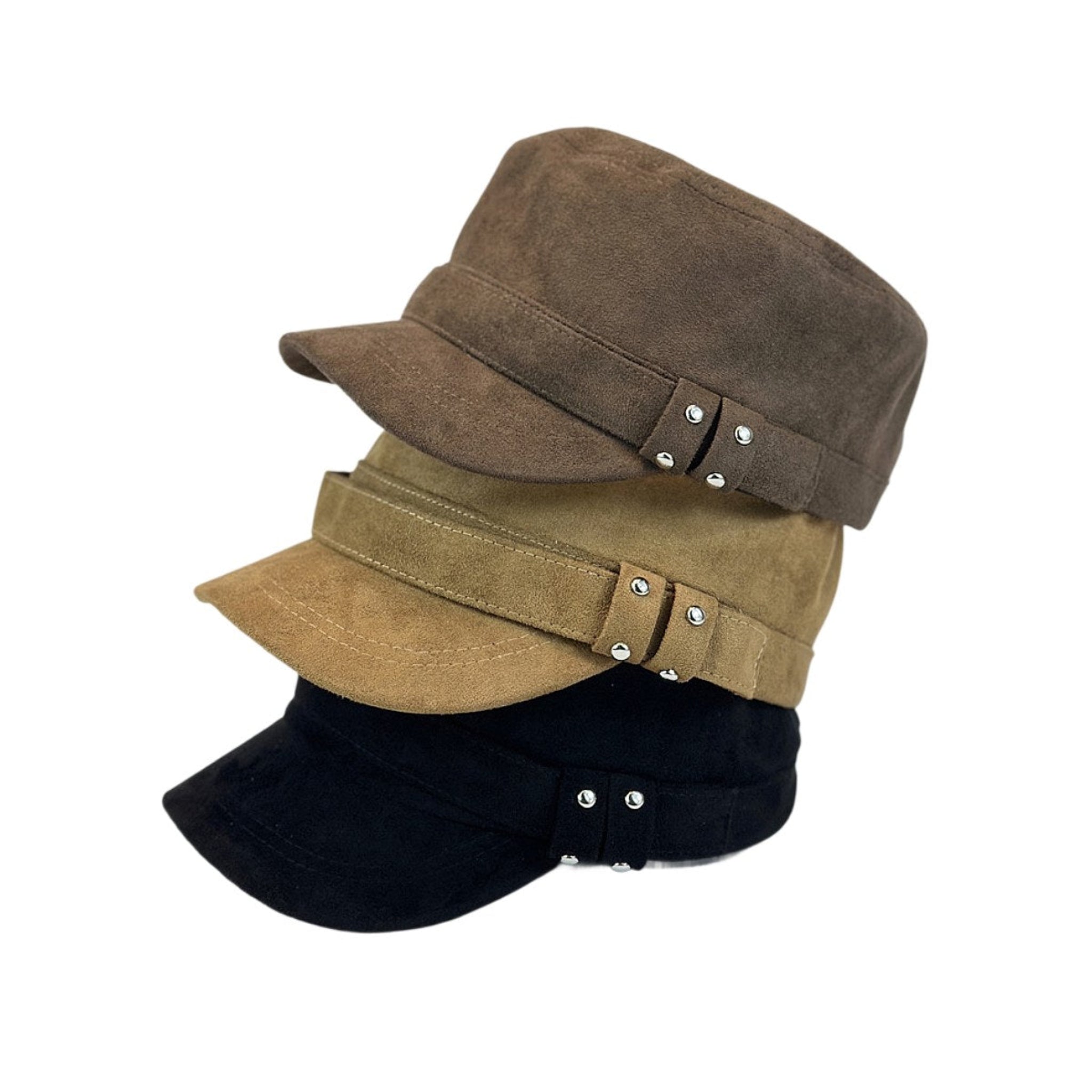Three suede flat caps in black, camel, and brown layered for a stylish equestrian look 
