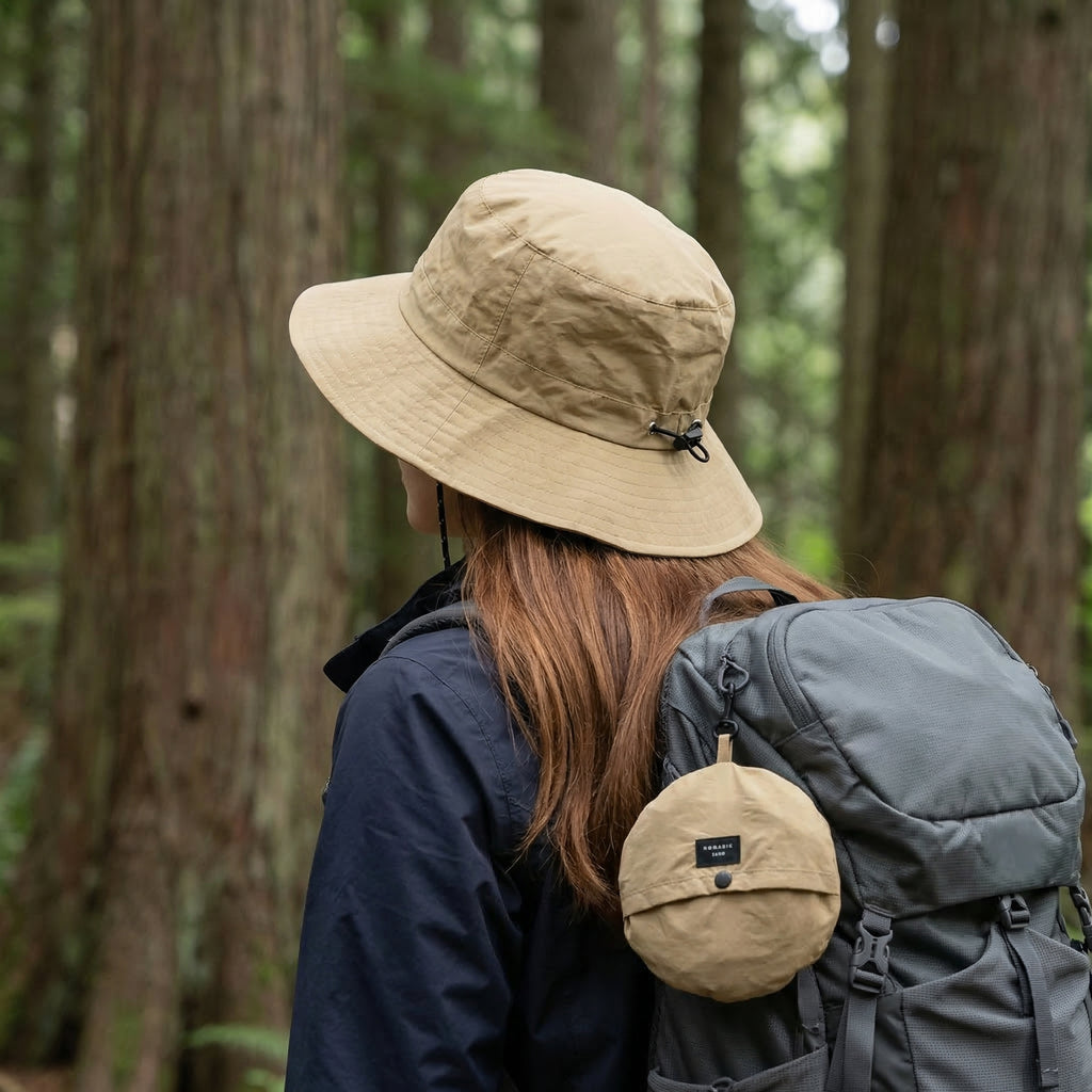 a women wear waterproof bucket hat with string for hiking，Foldable for Easy Carrying